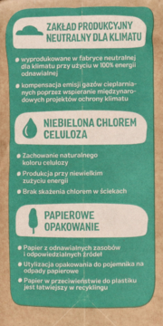 Zielona etykieta na opakowaniu pieluszek Babydream: produkcja neutralna dla klimatu, niebielona celuloza, papierowe opakowanie.