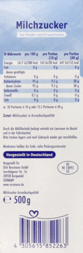Tył opakowania niemieckiego cukru mlecznego Milchzucker 500g, z tabelą odżywczą, składem i kodem kreskowym.