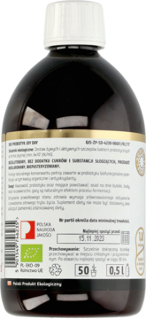 Tył ciemnej butelki EKO PROBIOTYK JOY DAY z etykietą, widoczne informacje o produkcie bezglutenowym i dacie ważności.