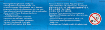 Bok opakowania Lego City Radiowozu z białym tekstem ostrzeżenia przed małymi częściami i symbolem 0-3.