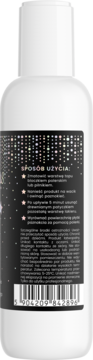 Tył białej butelki płynu do usuwania lakieru hybrydowego z czarną, błyszczącą etykietą i instrukcją użycia.
