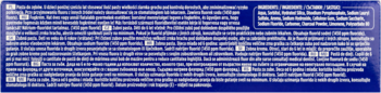 Granatowe opakowanie wybielającej pasty do zębów, widok na panel z drobnym białym tekstem opisowym.