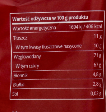Tył opakowania ekologicznych krówek. Zbliżenie na etykietę wartości odżywczej produktu w 100 g.