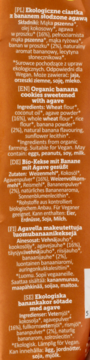 Etykieta ekologicznych ciastek z bananem słodzonych agawą na pomarańczowym tle, z opisem i składem.