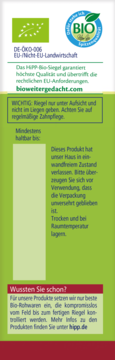 Tył zielonego opakowania batonika HiPP BIO, z niemieckim tekstem o certyfikacji BIO, ostrzeżeniami i adresem hipp.de.
