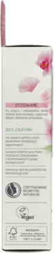 Boczna ścianka białego opakowania kremu Alterra Orchidea z różowymi kwiatami i logo Vegan, tekst o naturalnych składnikach.