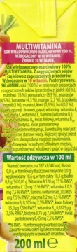 Tył żółtego kartonu soku wieloowocowo-marchwiowego multiwitamina z detalicznym opisem składu.