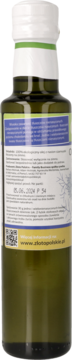 Tył butelki z ekologicznym olejem z czarnuszki tłoczonym na zimno. Zielone szkło, biała nakrętka, etykieta z tekstem i QR.