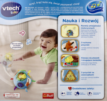 Vtech Baby kula Spryciula, niebiesko-białe pudełko z uśmiechniętym dzieckiem bawiącym się kolorowymi kulami.