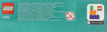 Tył pudełka LEGO Friends 41754 w kolorze turkusowym z ostrzeżeniami, logo LEGO Builder App i kolorowymi klockami.