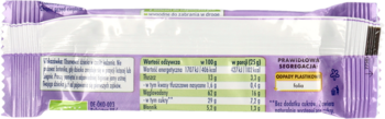 Tył fioletowego opakowania, prezentujący wartości odżywcze produktu na 100g oraz na porcję 21g.
