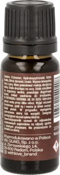 Tył brązowej szklanej butelki olejku z czarną nakrętką. Etykieta Made in Poland z logo @withlove_brand.
