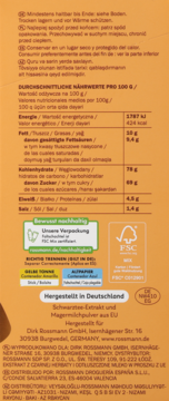 Tył pomarańczowego opakowania Laudatio chai latte z tabelą wartości odżywczych, logo FSC i danymi producenta.