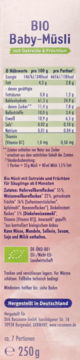 Jasnoróżowe opakowanie BIO Baby-Müsli 250g, z tabelą odżywczą, certyfikatem BIO i napisem Made in Germany.