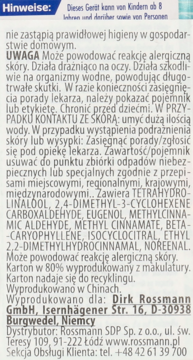Zbliżenie na polską etykietę odświeżacza Domol Tropical Fruits, z informacjami o składnikach i ostrzeżeniami.