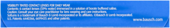 Blue packaging with blurry legal text, including Bausch+Lomb contact lens disclaimer and bausch.com.
