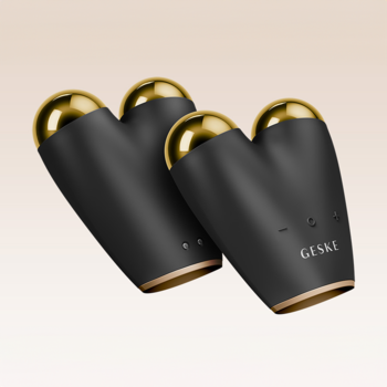 Dwa czarne, sercowate urządzenia GESKE 6w1 do mikroprądowego liftingu twarzy ze złotymi detalami, widok pod kątem.