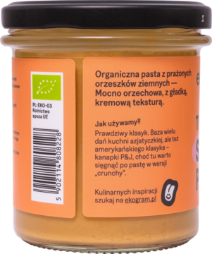 Tył słoika BIO pasty orzechowej Ekogram The Real Peanut Taste, pomarańczowa etykieta z opisem i logo PL-EKO-05.