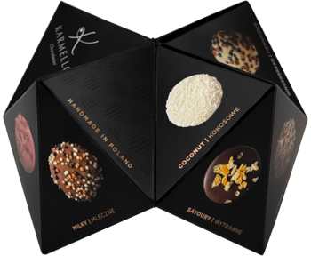 Geometryczne czarne pudełko Karmellos z pralinami handmade: kokos, orzechy, skórka pomarańczowa. Widok z góry.