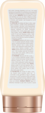 Tył balsamu Hawaiian Tropic Glowing Protection Lotion SPF50 w beżowej butelce z miedzianą zakrętką, widoczne instrukcje.