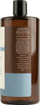 Tył brązowej butelki płynu do kąpieli Sense of Pleasure Wanilia i drzewo sandałowe, z etykietą z listą składników i niebieskim paskiem.