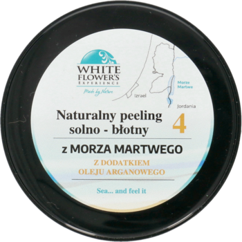 Czarny okrągły słoik peelingu solno-błotnego White Flowers z Morza Martwego z olejem arganowym, widok z góry.