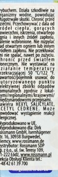 Tył opakowania sprayu Rossmann z etykietą w języku polskim, widoczne ostrzeżenia, składniki i dane kontaktowe.