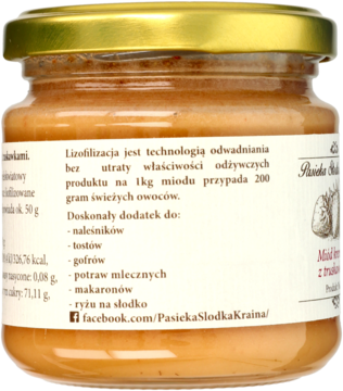 Tył szklanego słoika miodu kremowego z truskawkami Pasieka Słodka Kraina. Etykieta o liofilizacji i zastosowaniach.