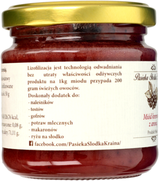Tył słoika miodu kremowego z aronią. Widać etykietę z opisem liofilizacji i zastosowań produktu.