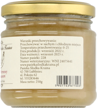 Tył szklanego słoika miodu kremowego z bananem, widoczna jasna etykieta z danymi producenta i kodem kreskowym.
