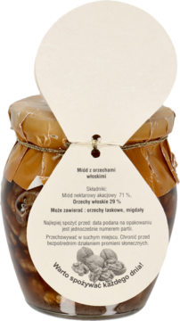 Miód akacjowy z orzechami włoskimi w szklanym słoiku, widok z przodu, z kremową etykietą w kształcie serca.