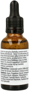 Tył brązowej butelki serum do twarzy z kwasem traneksamowym, biała etykieta z polskim tekstem i składnikami.