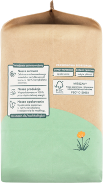 Tył opakowania ekologicznych pieluszek Babydream Junior 5. Brązowy papier, zielony wzór, napisy o zrównoważonym rozwoju.