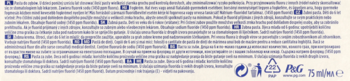 Tył opakowania pasty do zębów z opisem jej cech w wielu językach, w tym wybielania, oraz logiem P&G.