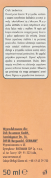 Tył pomarańczowego opakowania odświeżacza powietrza Rossmann 50 ml, z białą etykietą, widoczne ostrzeżenia i dane producenta.
