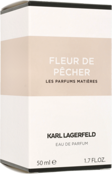 Białe pudełko perfum Karl Lagerfeld Fleur De Pêcher, z jasnoróżową wstęgą i czarnym napisem, widok z przodu.