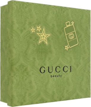 Zielone, ozdobne pudełko prezentowe Gucci Guilty, z złotymi gwiazdami i ikoną perfum, widok pod kątem.
