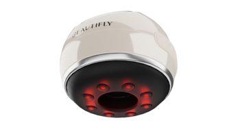 Beautifly B-bubble, beżowa bańka masująca z widocznymi czerwonymi diodami LED od spodu i srebrnym pierścieniem.