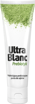 UltraBlanc Prebiotyk, wybielająca pasta do zębów w białej tubce z zielonym proszkiem na górze, widok z przodu.