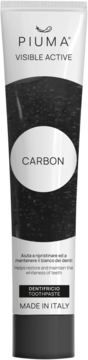 Piuma Visible Active Carbon toothpaste for teeth whitening, white tube, black paste visible.