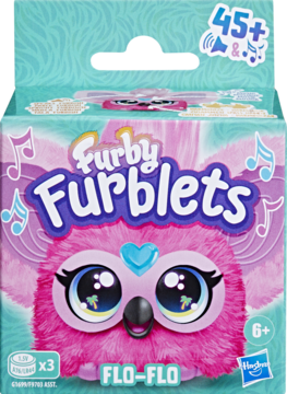 Furby Furblets Flo-Flo, różowy interaktywny furbiś w opakowaniu, 45+ reakcji dźwiękowych, widok z przodu.