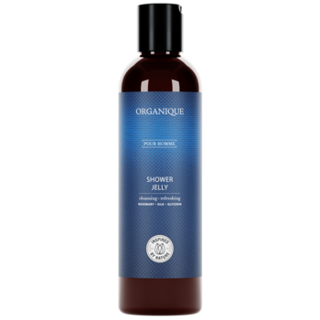 Ciemnobrązowa butelka Organique Shower Jelly z czarną zakrętką i niebieską etykietą z białym tekstem, widok z przodu.