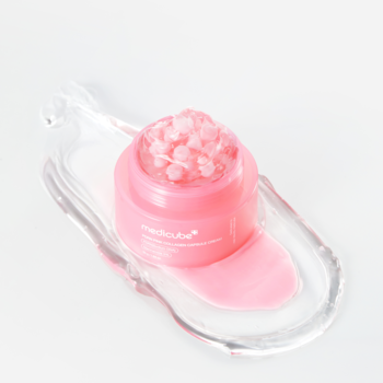 Medicube PDRN Pink Collagen Capsule Cream, nawilżający, z różowymi kapsułkami w otwartym słoiczku.