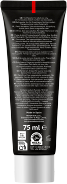 Tył czarnej tubki WOOM CARBON+ wybielającej pasty do zębów 75 ml, z tekstem w wielu językach i logo Halal.