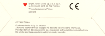 Tył białego opakowania puzzli dla dzieci, z czarnym tekstem ostrzeżeń, danymi producenta i znakiem CE.