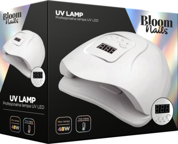 Biała lampa UV LED Bloom Nails 48W do paznokci na tle czarnego pudełka, widok z przodu, lekko pod kątem.