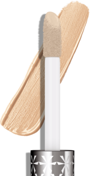 Zbliżenie na miękki aplikator beżowego korektora Rimmel Multi-Tasker i widoczny swatch produktu.