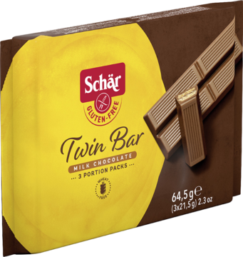Schär Twin Bar, mleczna czekolada bezglutenowa, w brązowo-żółtym pudełku z widocznymi batonami, widok z przodu.