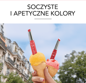 Dwie pomadki Bourjois Healthy Mix Sorbet jako lody w rożkach, różowa i pomarańczowa, na tle miejskich budynków.