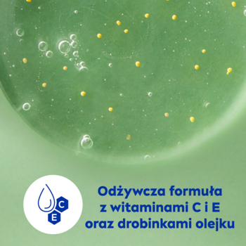 NIVEA Lemongrass & Oil żel pod prysznic: zbliżenie zielonego żelu z żółtymi drobinkami i wit. C+E.